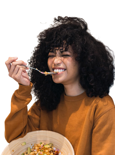 cheerful-black-woman-eating-healthy-salad